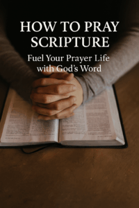 11 Hands folded in prayer over an open Bible on a wooden table, with overlay text reading “How to Pray Scripture: Fuel Your Prayer Life with God’s Word.”