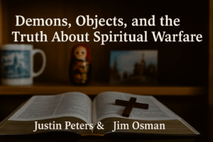 An open Bible lies on a wooden table with a wooden cross resting on its pages. In the background, a softly blurred bookshelf displays a ceramic mug, a Matryoshka doll, and a photo of St. Basil’s Cathedral. Text reads, ‘Demons, Objects, and the Truth About Spiritual Warfare’ with ‘Justin Peters & Jim Osman’ beneath. Warm, reverent lighting conveys a contemplative tone.