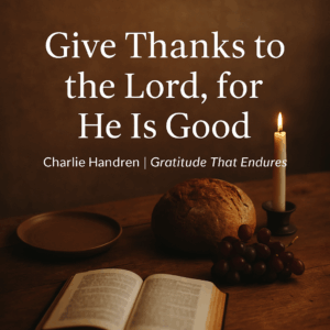 An open Bible beside a loaf of bread, grapes, and a lit candle on a wooden table, symbolizing gratitude for God’s provision and the goodness of the Lord.