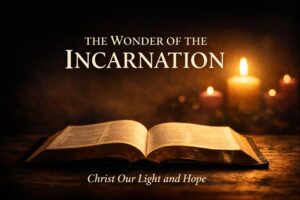 Open Bible illuminated by warm light with Advent candles in the background, representing Christ our light and hope and the wonder of the Incarnation at Advent.