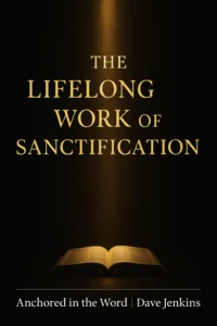 An open Bible illuminated by a vertical beam of warm golden light against a dark charcoal background, with the title ‘The Lifelong Work of Sanctification’ in gold serif text above and ‘Anchored in the Word | Dave Jenkins’ in white text below, symbolizing the refining work of sanctification.