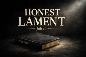 Closed Bible resting in darkness with a faint beam of light, symbolizing honest lament before God from Job 10.