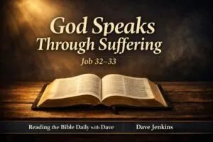 Thumbnail showing an open Bible resting on a wooden table with warm golden light shining through darkness. Overlay text reads ‘God Speaks Through Suffering — Job 32–33,’ branded with Reading the Bible Daily with Dave and Dave Jenkins.