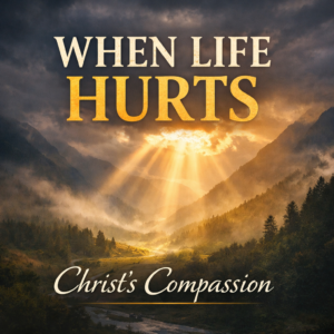 Sunlight breaking through dark clouds over a mountain valley with the words “When Life Hurts – Christ’s Compassion,” symbolizing hope in suffering and Christ’s comfort for believers.