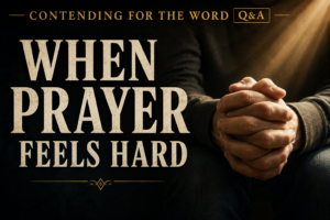 Clasped hands in prayer illuminated by warm golden light beside the words “When Prayer Feels Hard” on a dark background.